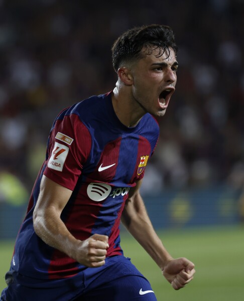 Barcelona gets late goals to win first official match at its